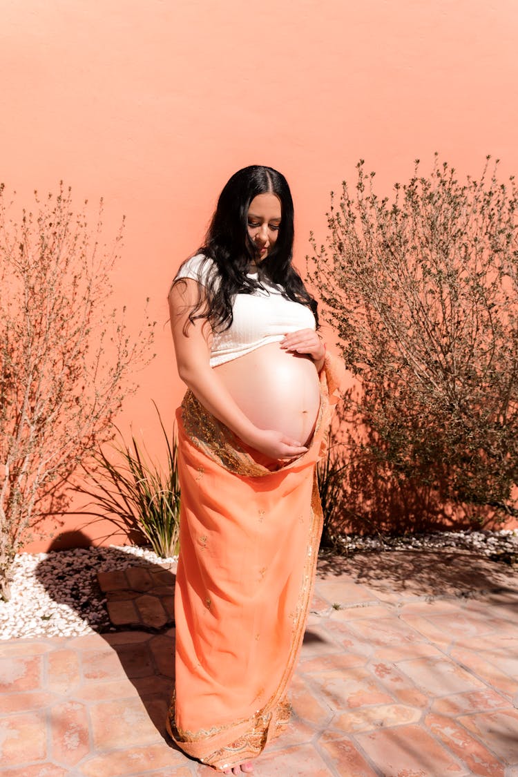 Young Woman Proud Of Her Pregnancy