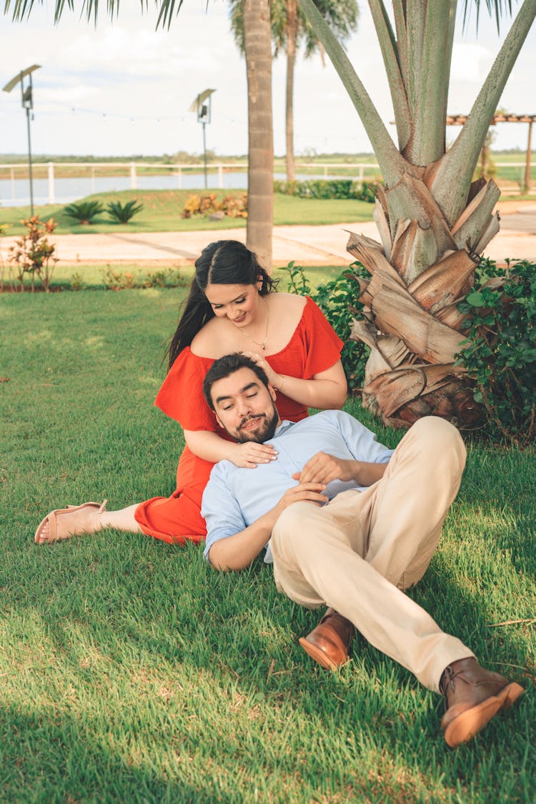 Couple Relaxing On Grass