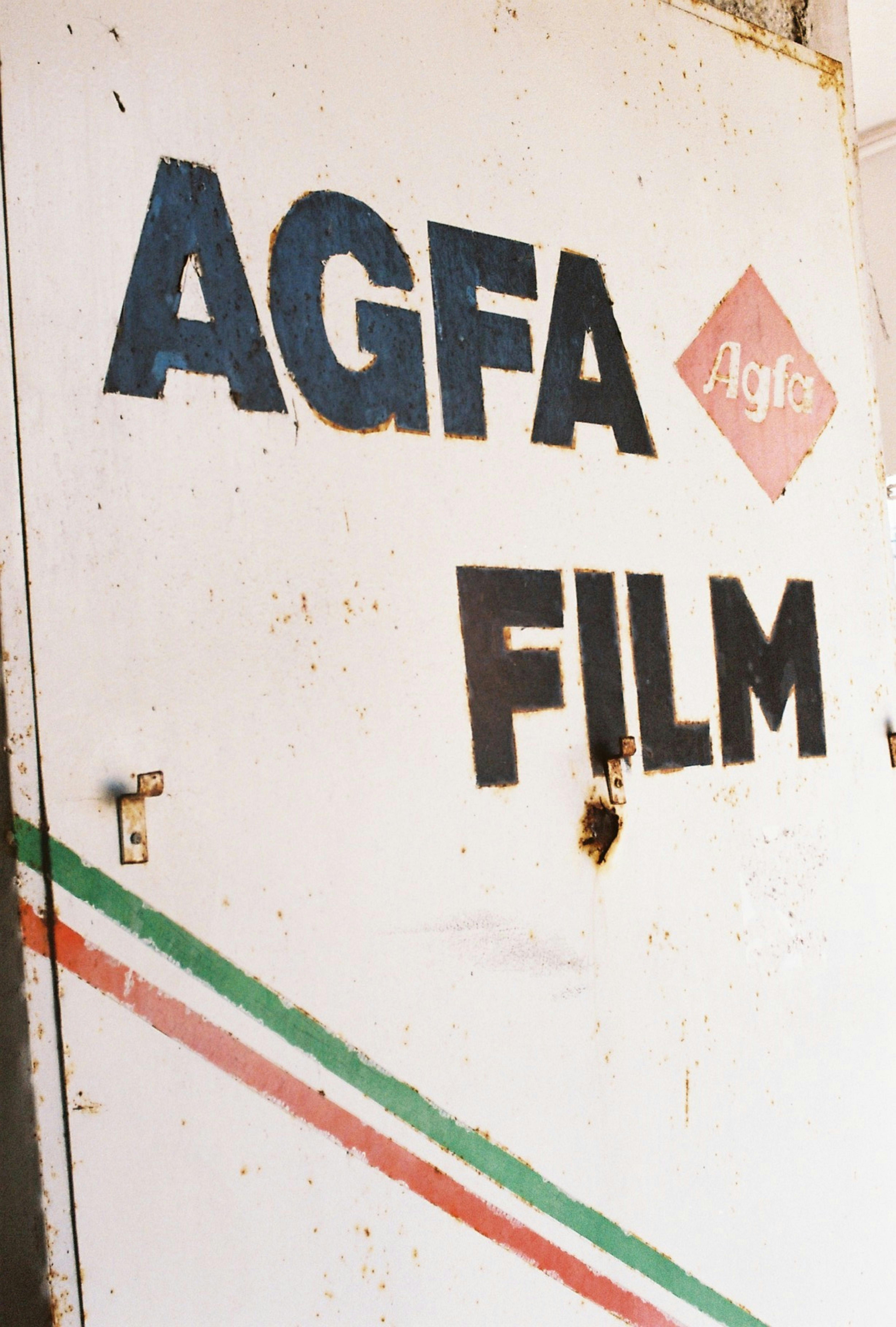 Close-up of a rusty AGFA film sign showcasing vintage branding in Istanbul.