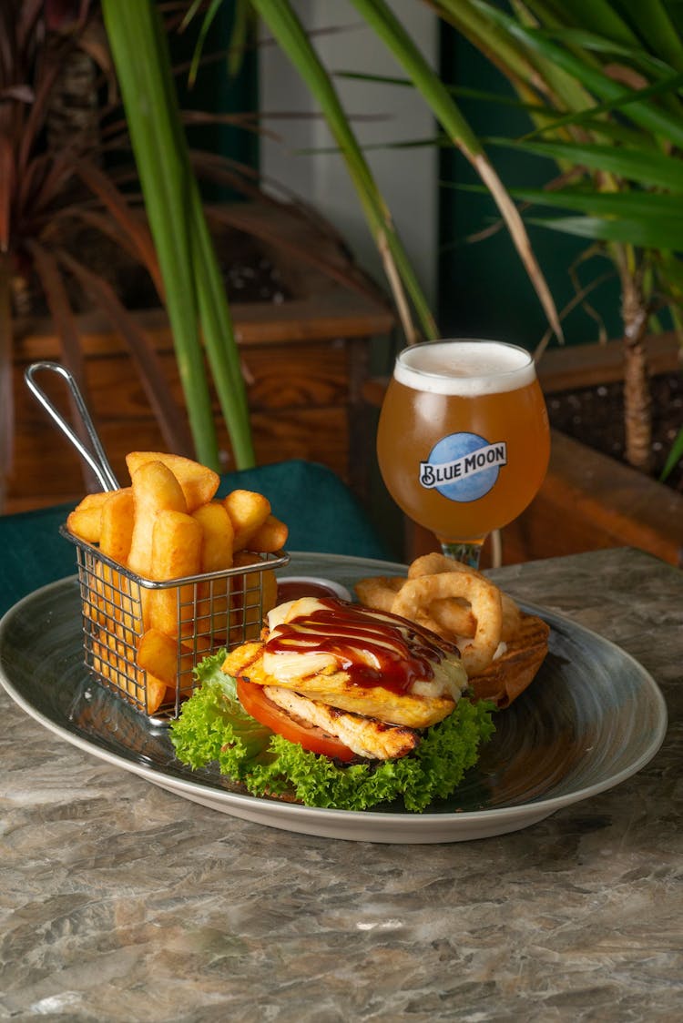 Burger And Chips With A Glass Of Beer 