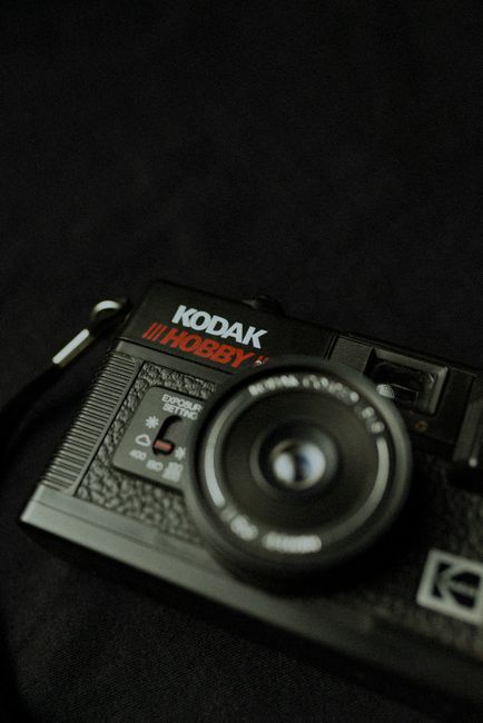 Close-up of a classic Kodak Hobby camera against a dark background, showcasing vintage design.