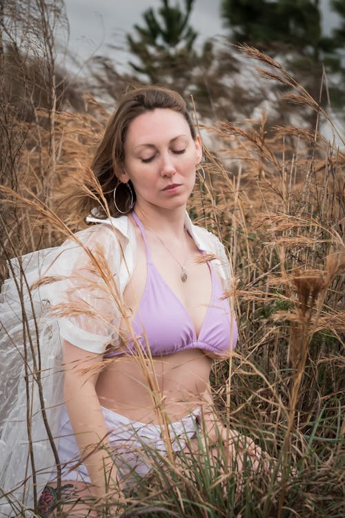 Woman Standing in Grass