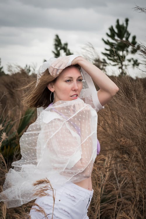 Woman Standing in Grass