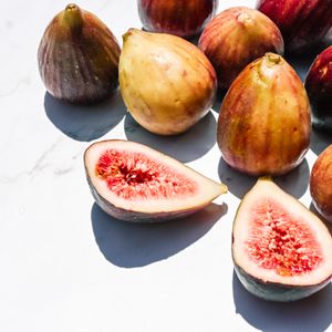 Whole and halved fresh figs — photo by Studio Naae on Pexels