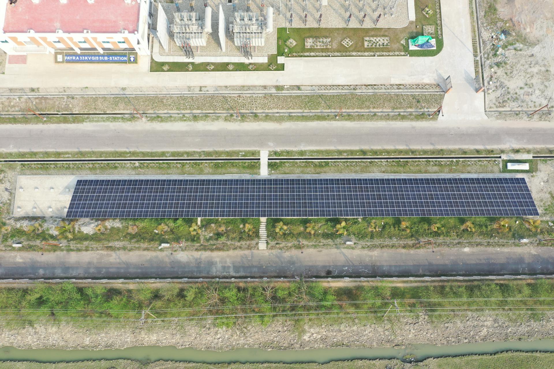 Aerial view of solar panel installation at Payra 33KV GIS Sub-Station, Golbania, supporting renewable energy.