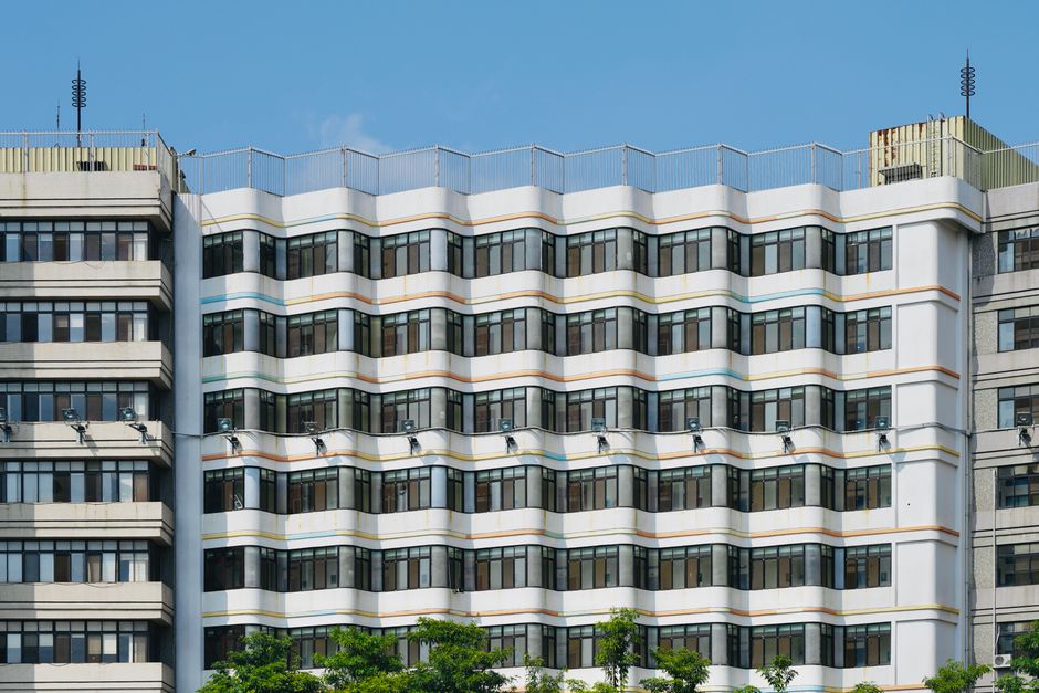 Contemporary building facade with distinctive geometric patterns, showcasing urban architectural design.
