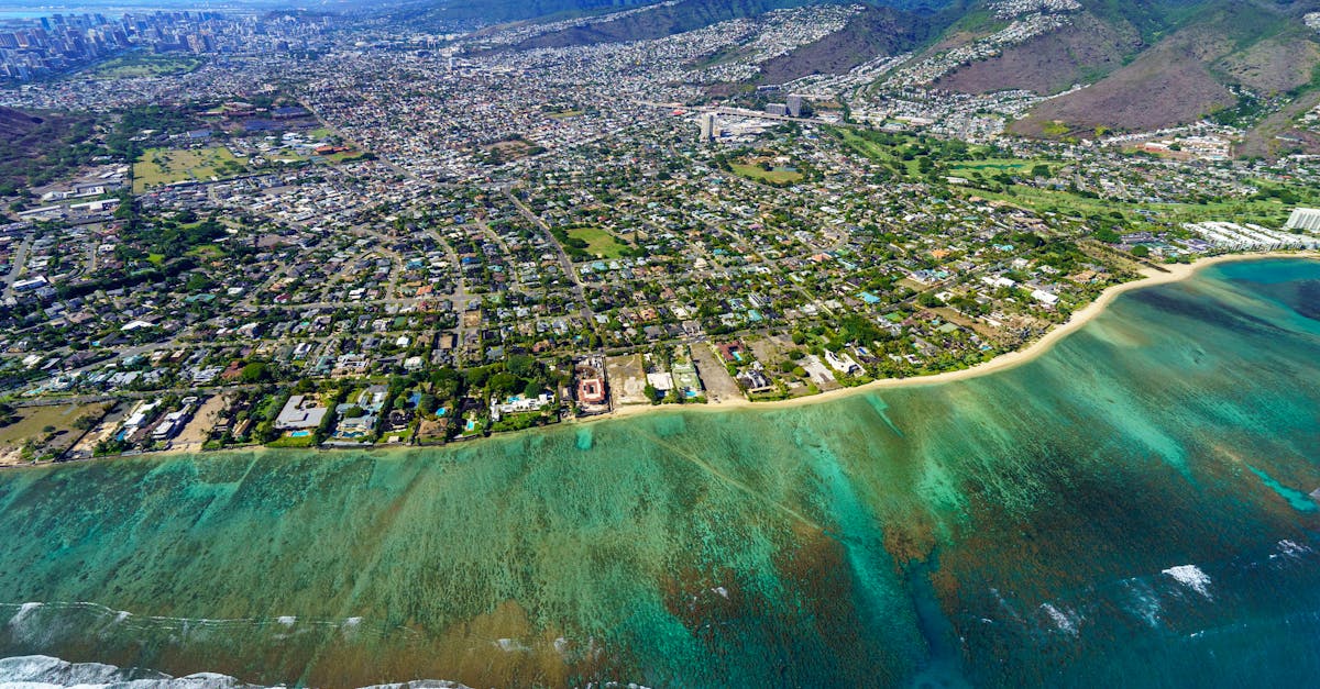 Photo by Cyrill Stunning aerial photo showcasing Honolulu's vibrant cityscape and turquoise ocean.