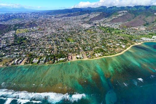 Stunning aerial photo showcasing Honolulu's vibrant cityscape and turquoise ocean.