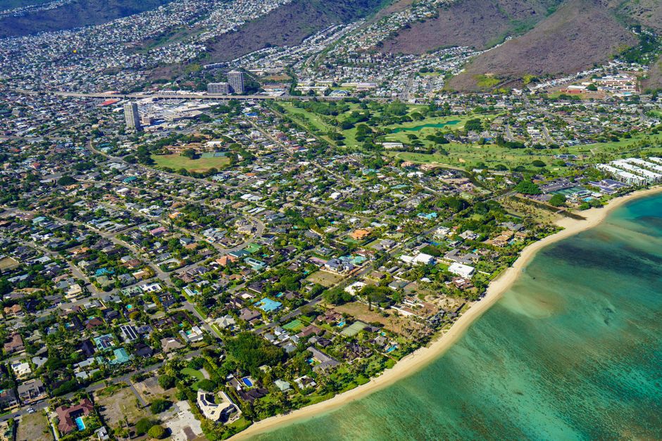 Photo by Cyrill Beautiful aerial view of Honolulu's coastline showcasing cityscape and beach.