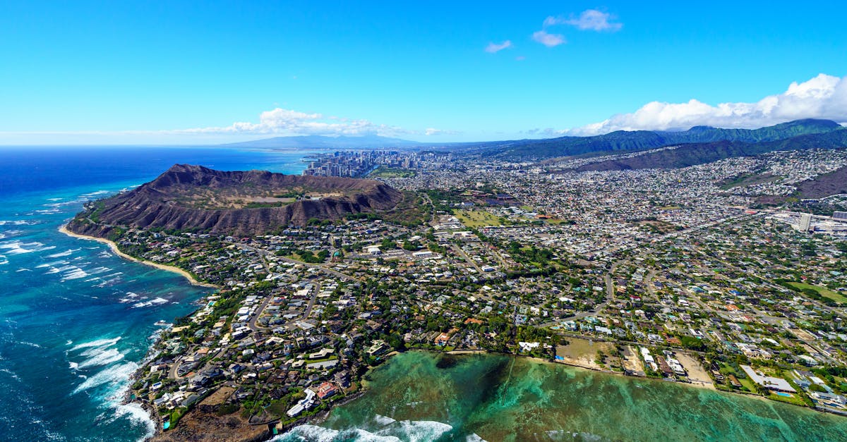 Photo by Cyrill Stunning aerial view of Honolulu with Diamond Head Crater and Pacific Ocean. Perfect for travel inspiration.