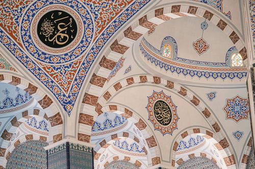 Free A detailed view of the colorful intricate patterns and calligraphy inside an Ottoman mosque in Bursa, Turkey. Stock Photo