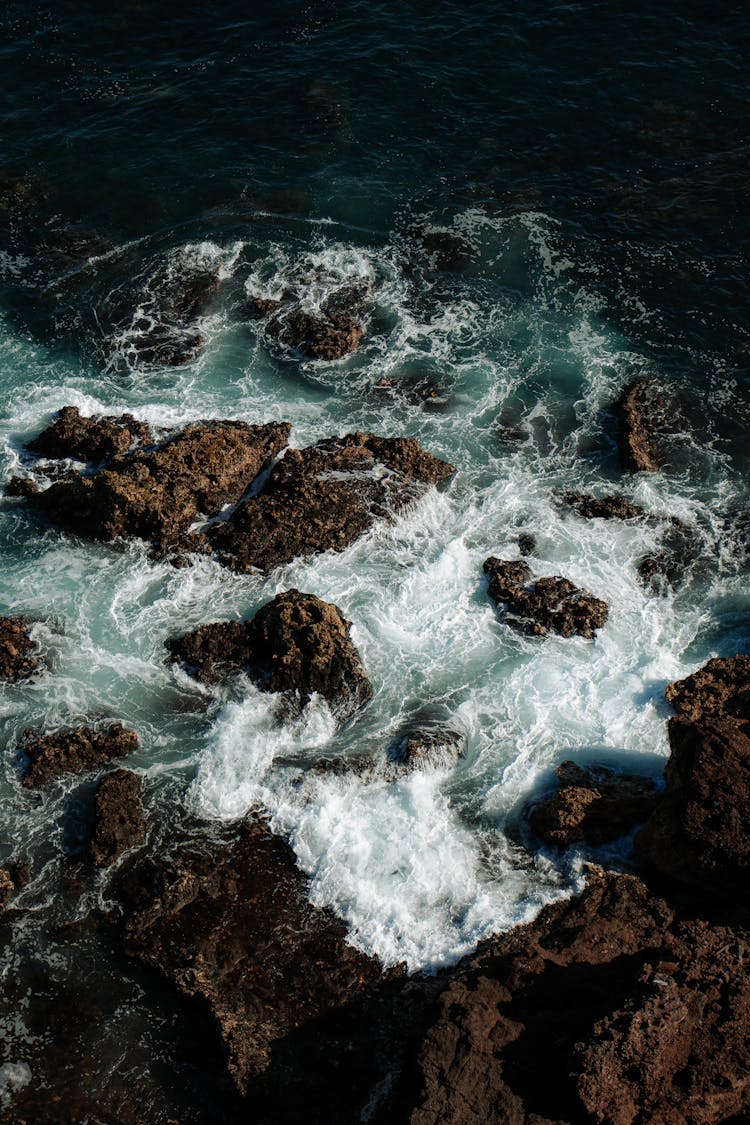 Sea Waves And Rocky Coastline