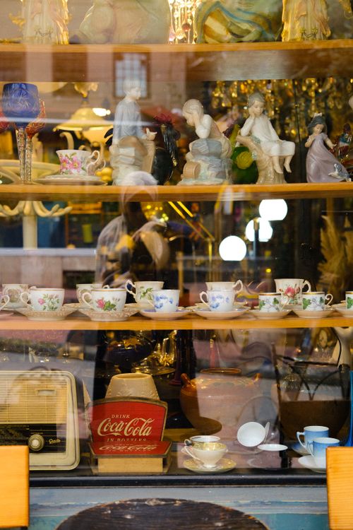 Free Explore a vintage window display of ceramics and antiques in an Istanbul shop. Stock Photo