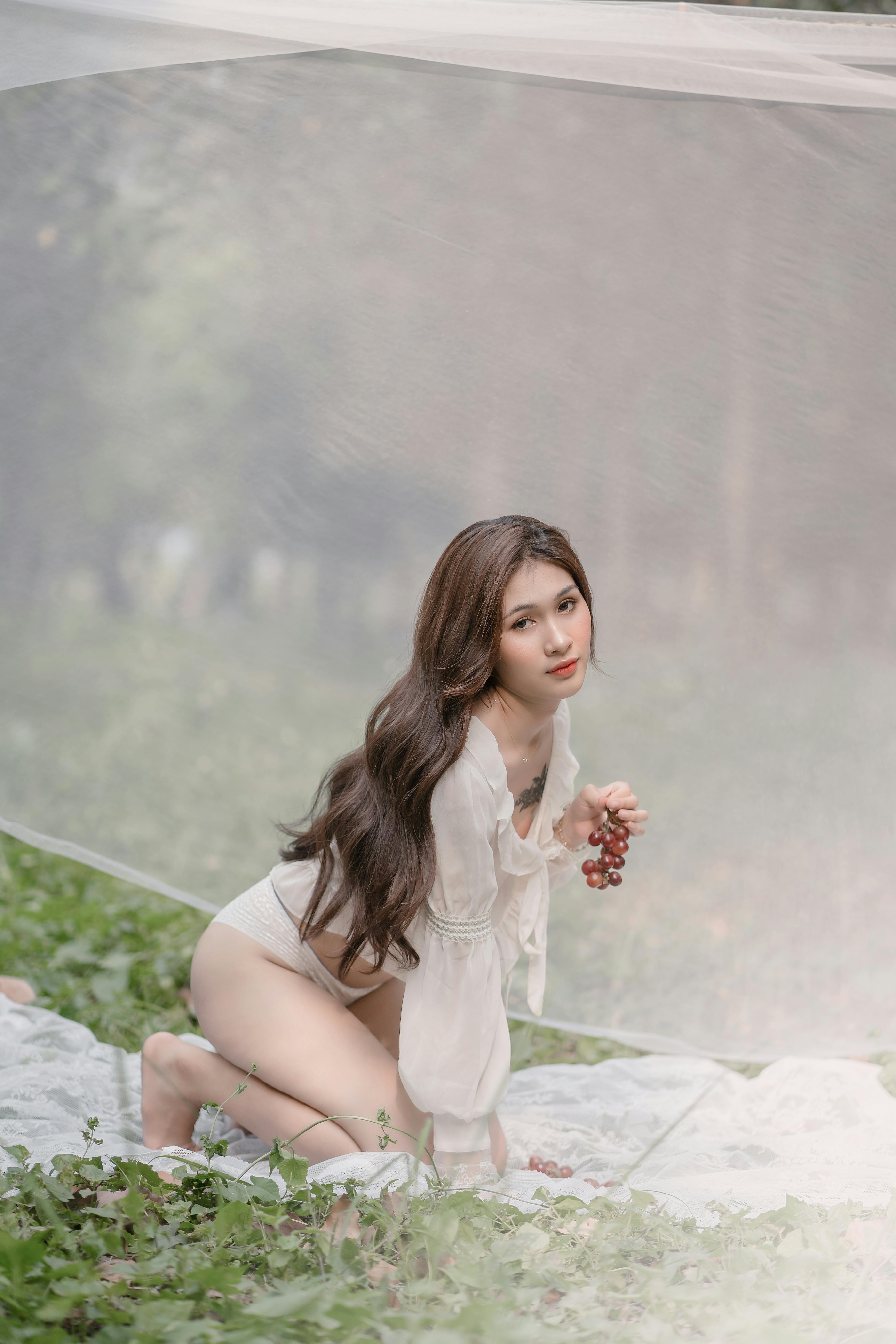 Brunette Woman in Pink T-Shirt and Panties Posing on Rooftop