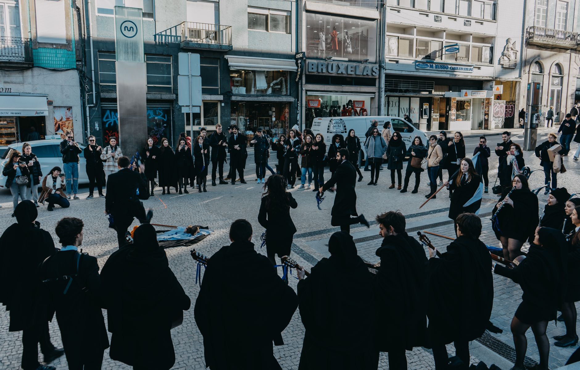 A vibrant street music performance in Oporto, Portugal, captivating passerby.