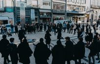 A vibrant street music performance in Oporto, Portugal, captivating passerby.