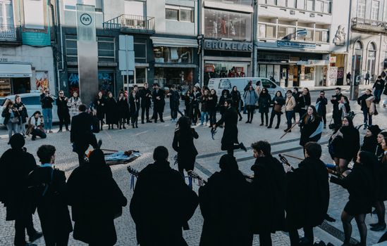 A vibrant street music performance in Oporto, Portugal, captivating passerby.