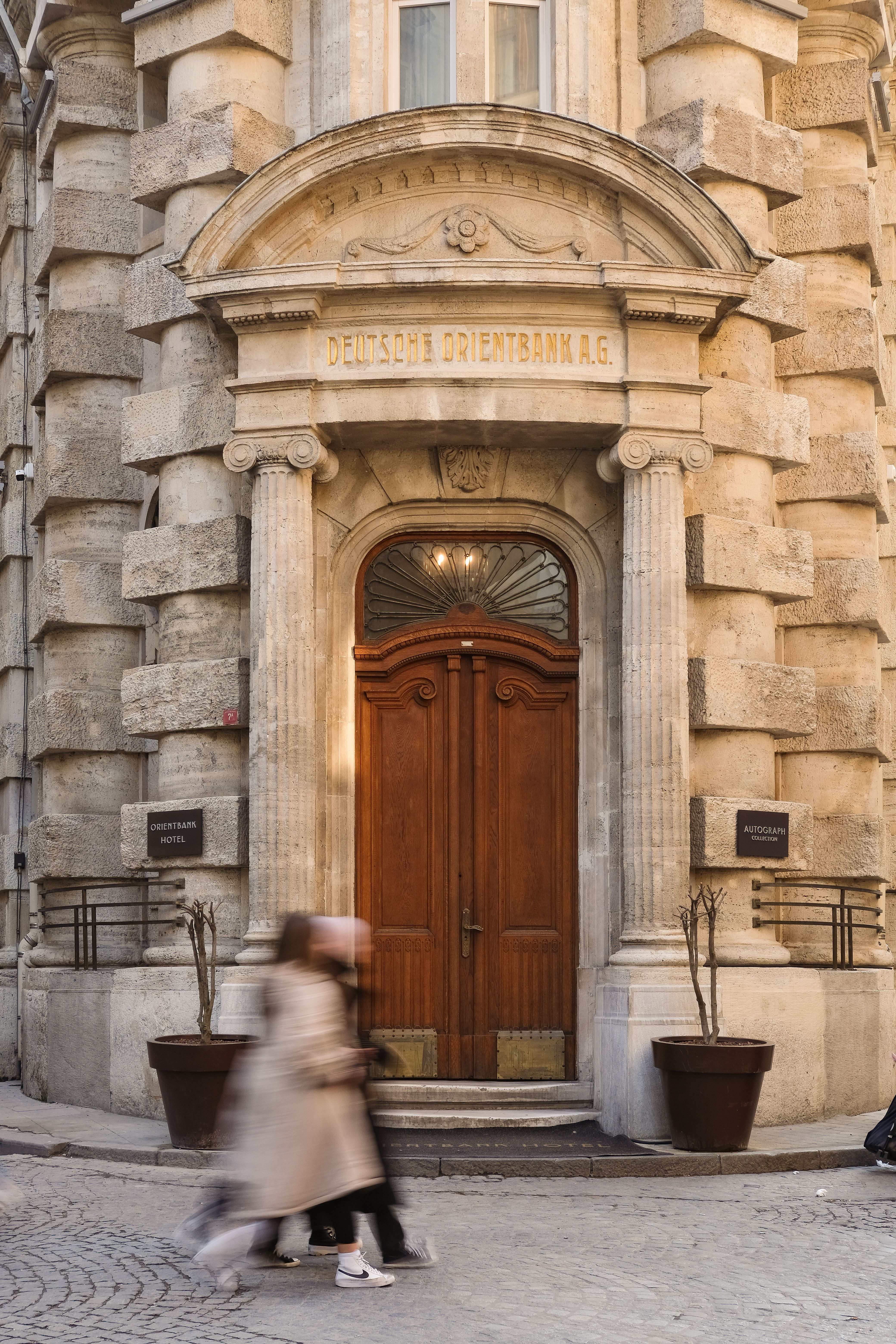 A bank vault door in soft light