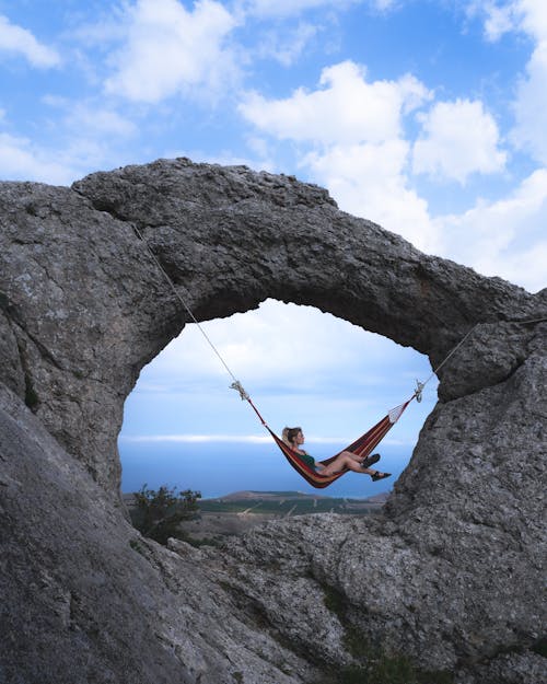 Free Woman Relaxing in Hammock Stock Photo