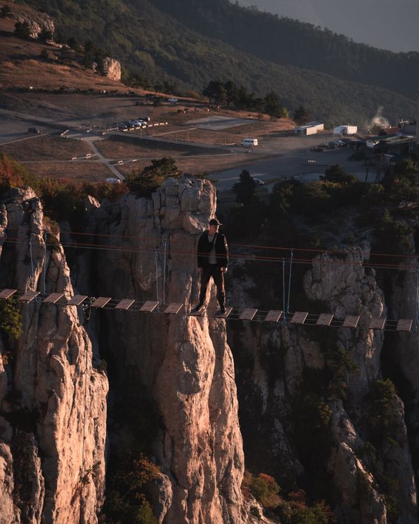 Man on Rope Bridge over Canyon · Free Stock Photo