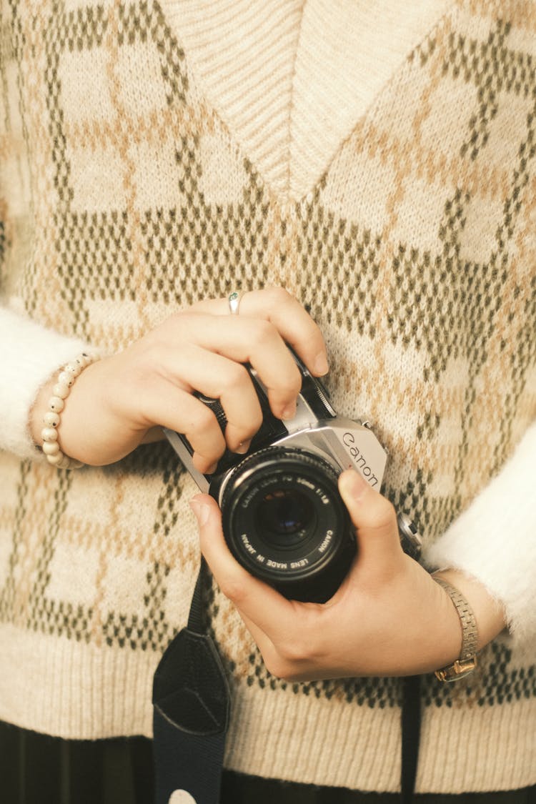 Midsection Of A Woman Holding A Camera