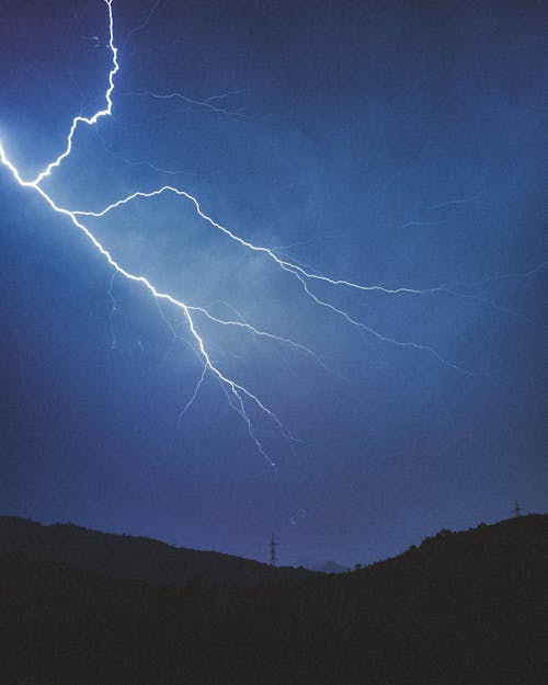 Lightning on Sky above Hills