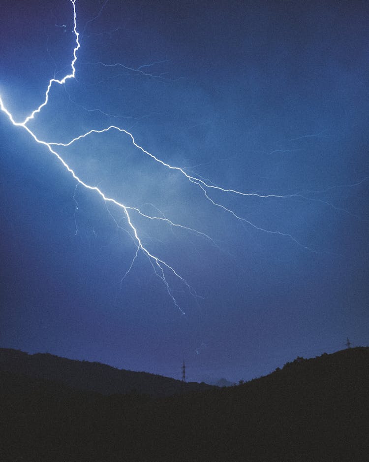 Lightning On Sky Above Hills