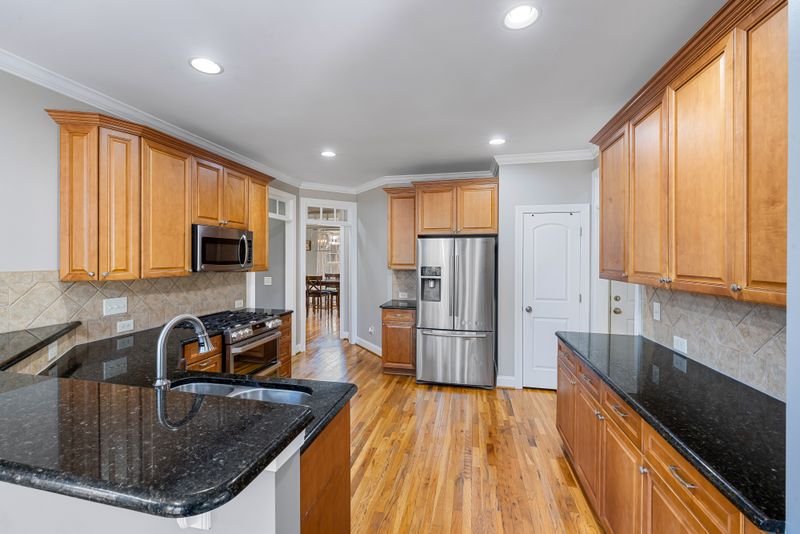 Powder Blue Cabinets with Warm Wood Flooring