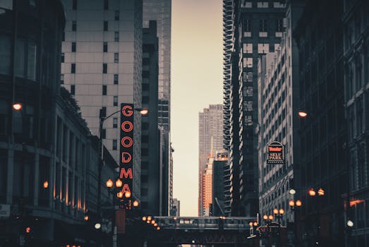 Skyline of downtown Chicago at dusk, showcasing modern architecture and urban life.