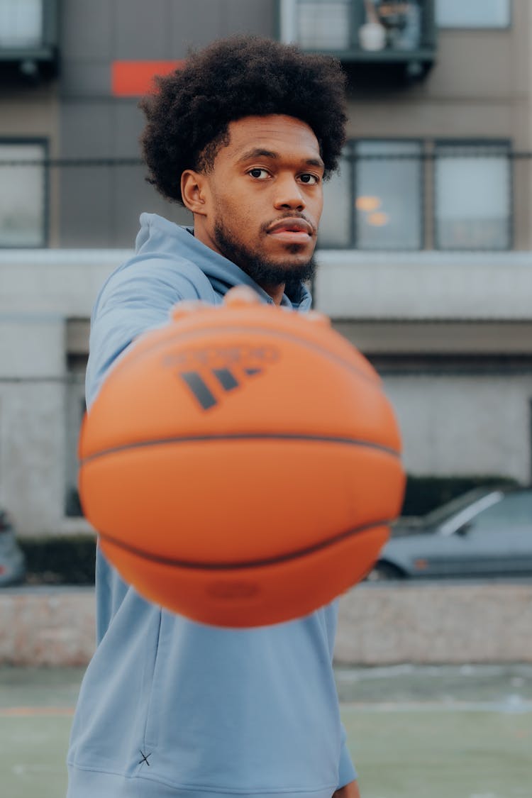 Black Man Holding Basketball Ball 