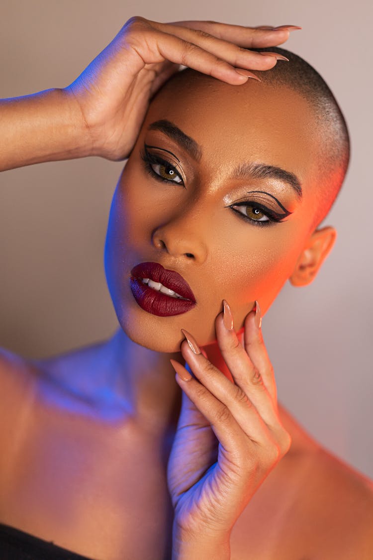 Woman Touching Her Face In A Photoshoot