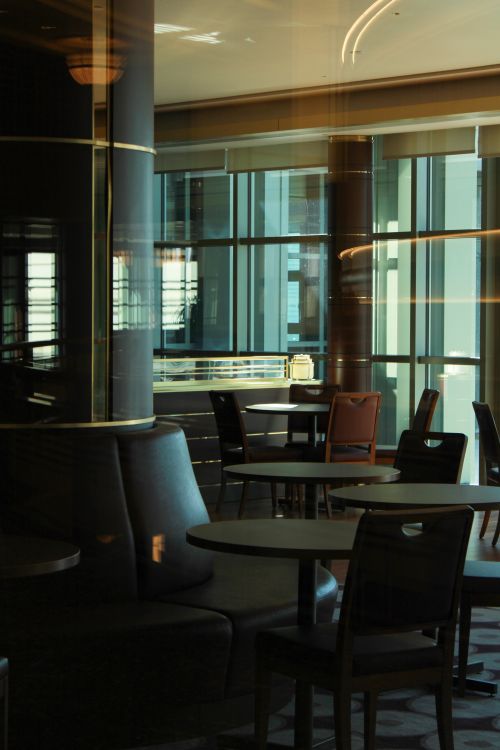 Free Cozy restaurant interior in Ankara, Türkiye, featuring modern furniture and large sunlit windows. Stock Photo