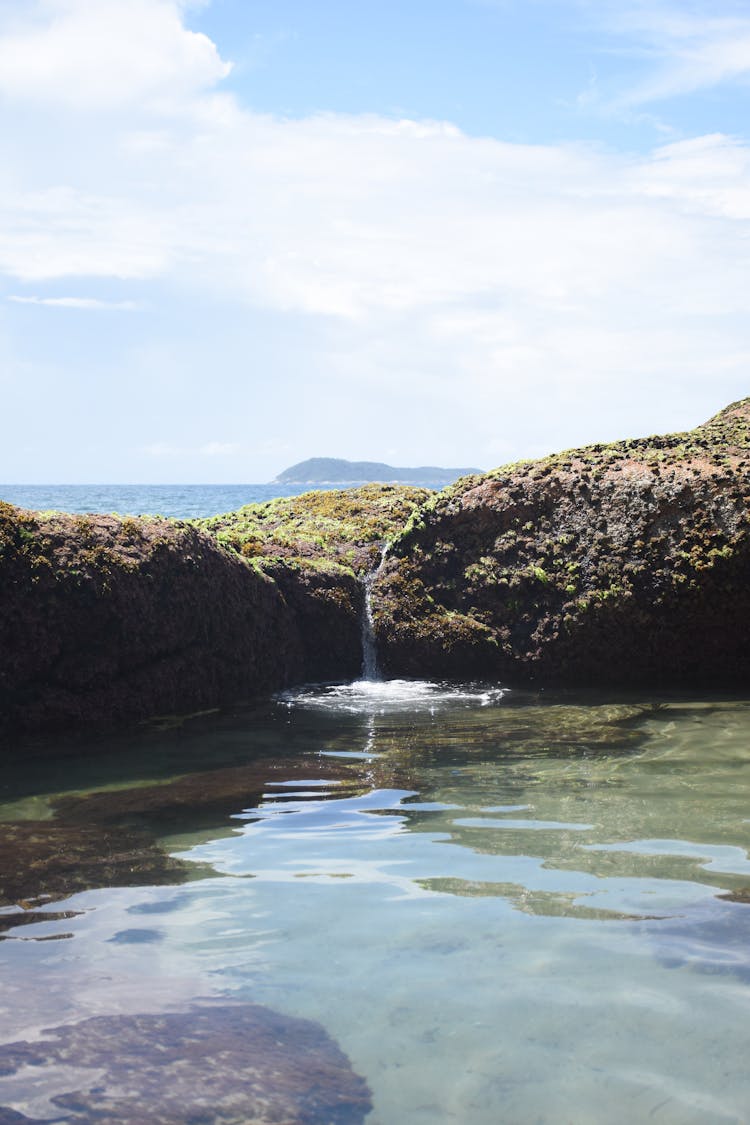 Pool With Rocks Near Ocean Shore