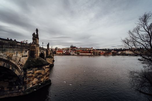 Charles Bridge at sunrise with a photographer — Prague