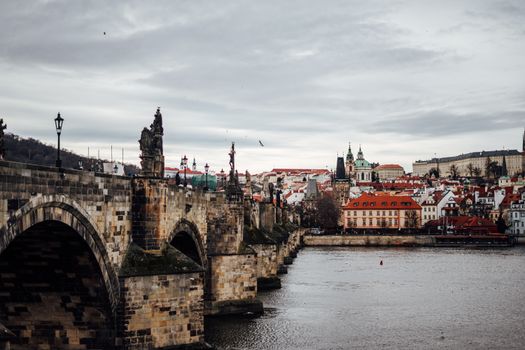 Charles Bridge at sunrise with a photographer — Prague