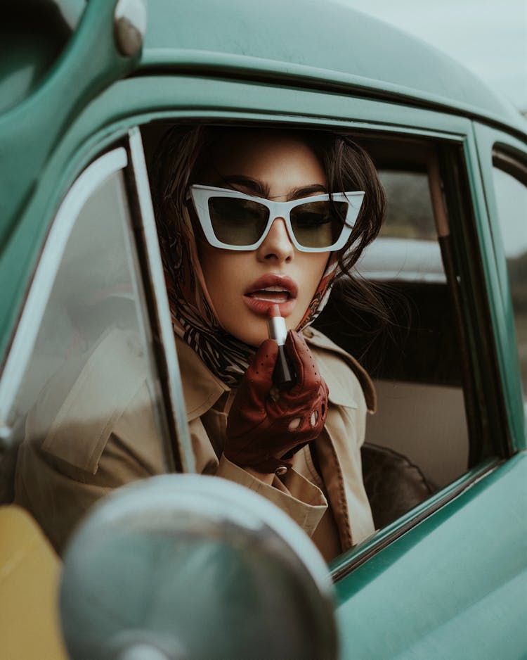 Woman With Lipstick Wearing Old Fashioned Clothing And Sunglasses