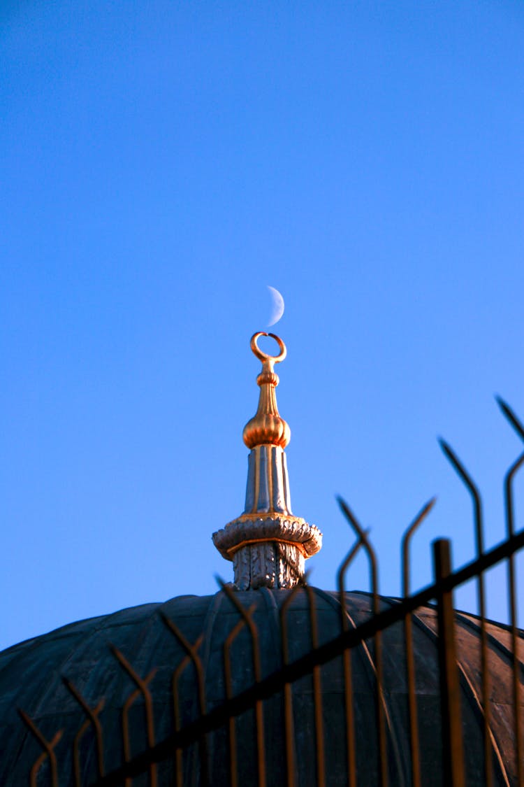 Moon Rising Over A Mosque Finial