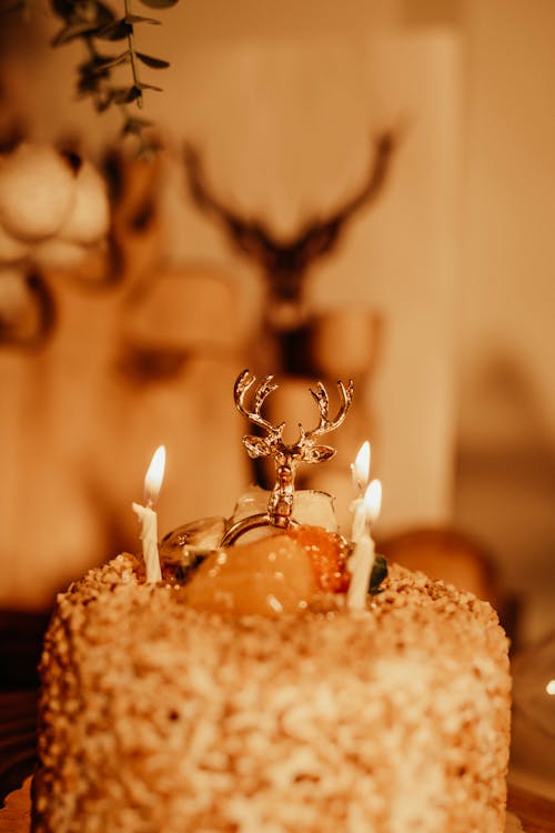 Ring with a Deer Head Decorating a Birthday Cake