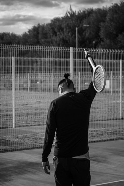 Tennis pPlayer on the Court Throwing a His Racket