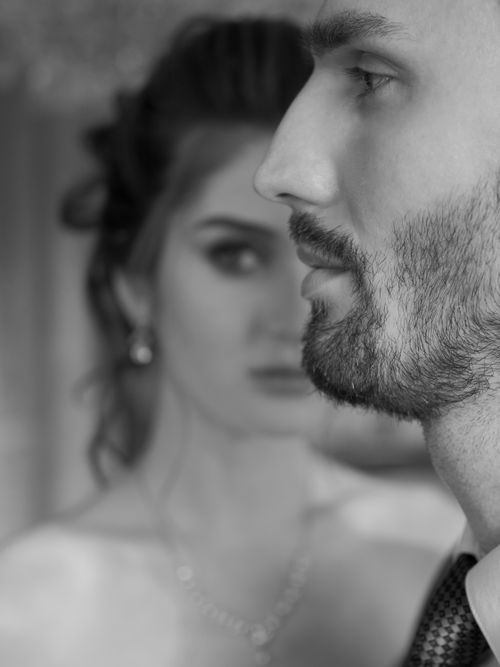 Free Sophisticated black and white portrait of a couple emphasizing contrast and elegance. Stock Photo