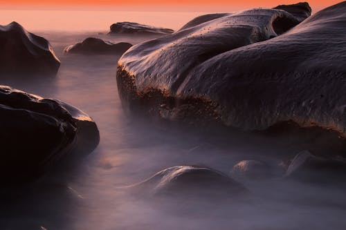 Photos gratuites de aube, blocs, bord de mer