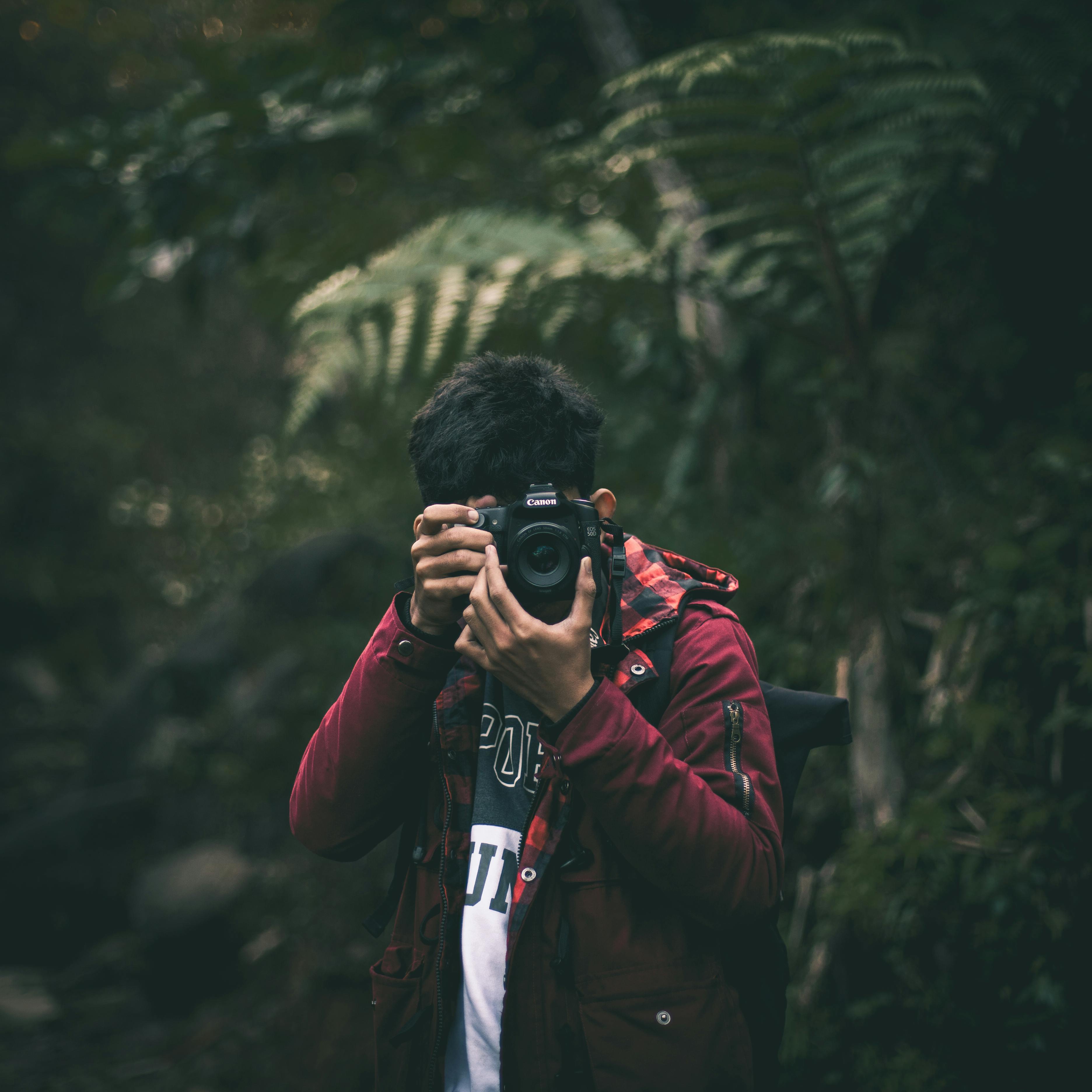 Photo of Man Holding a Camera