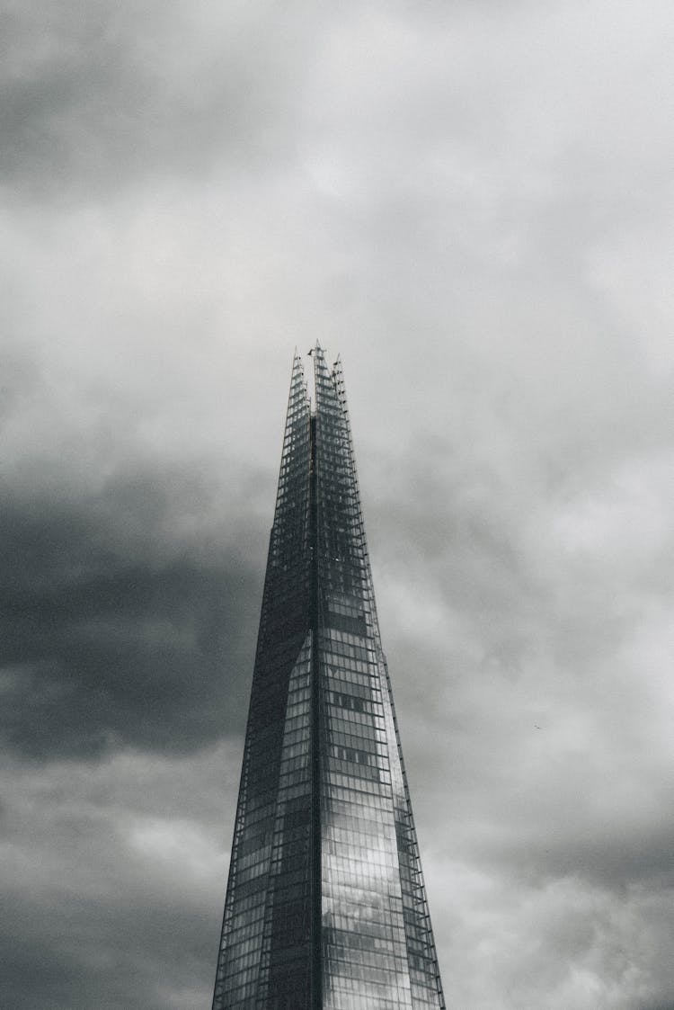 Modern Skyscraper Against Cloudy Sky