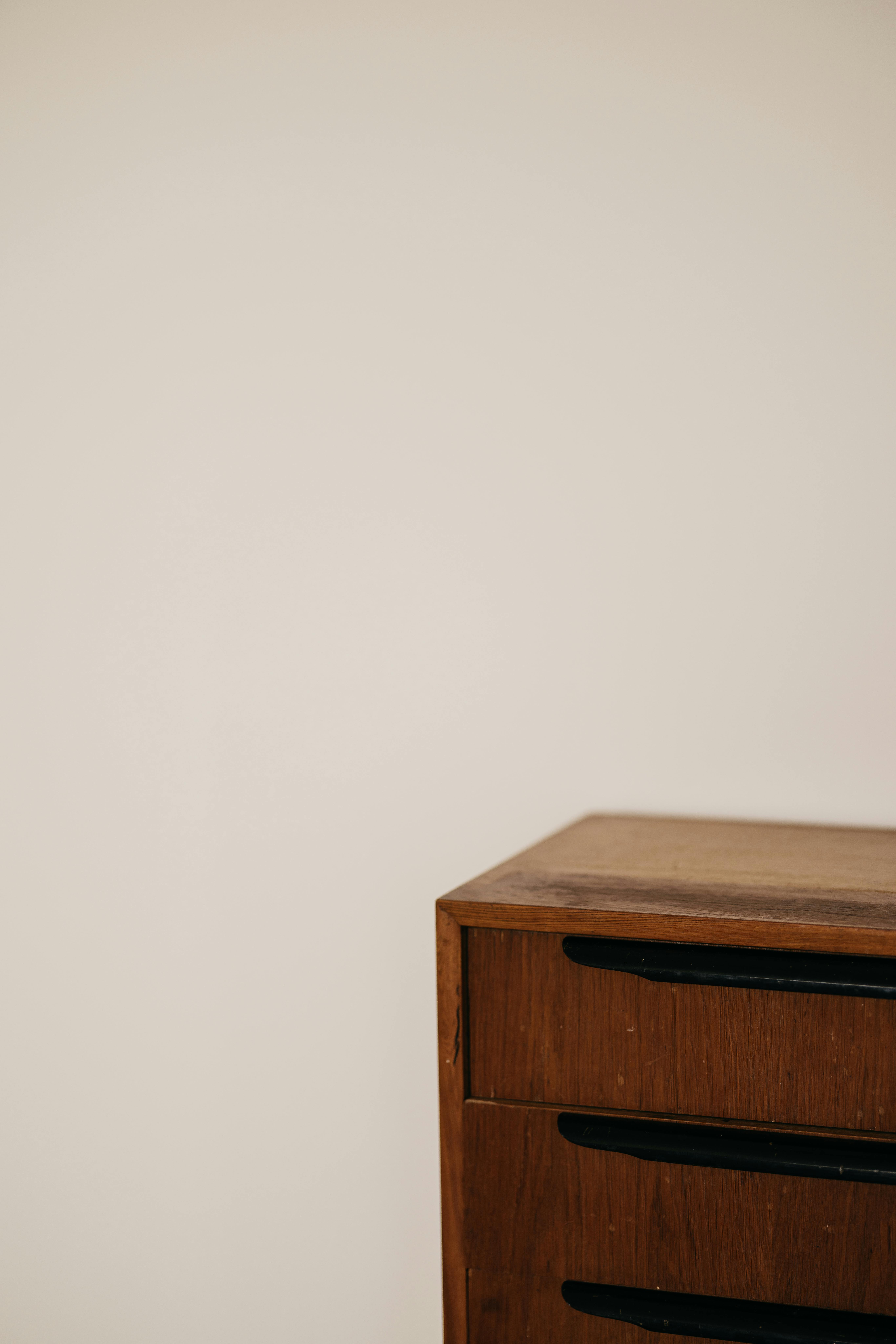 Free Close-up of a vintage wooden drawer on a white background, showcasing minimal design. Stock Photo