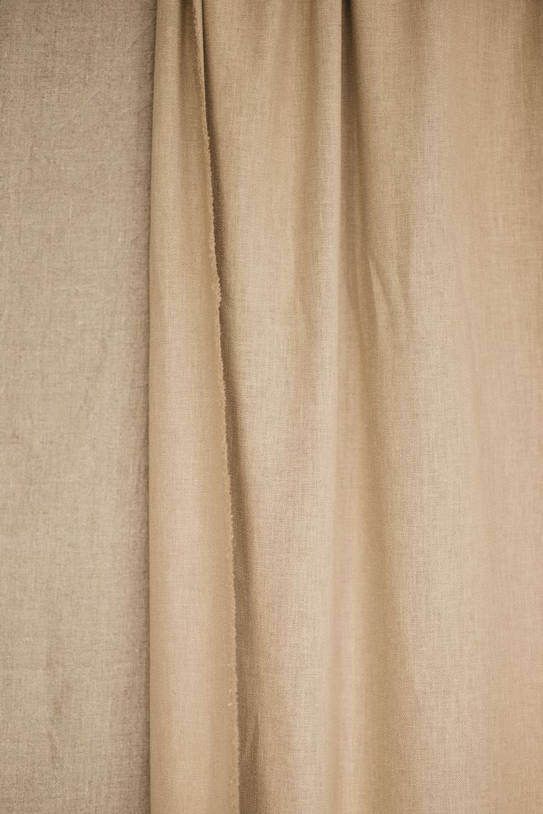 Loosely gathered natural linen curtain. Photo by Lisett Kruusim&auml;e on Pexels