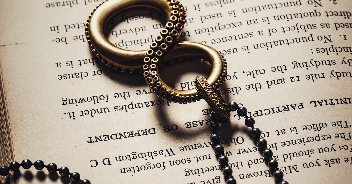 Octopus Infinity Symbol on Open Book · Free Stock Photo