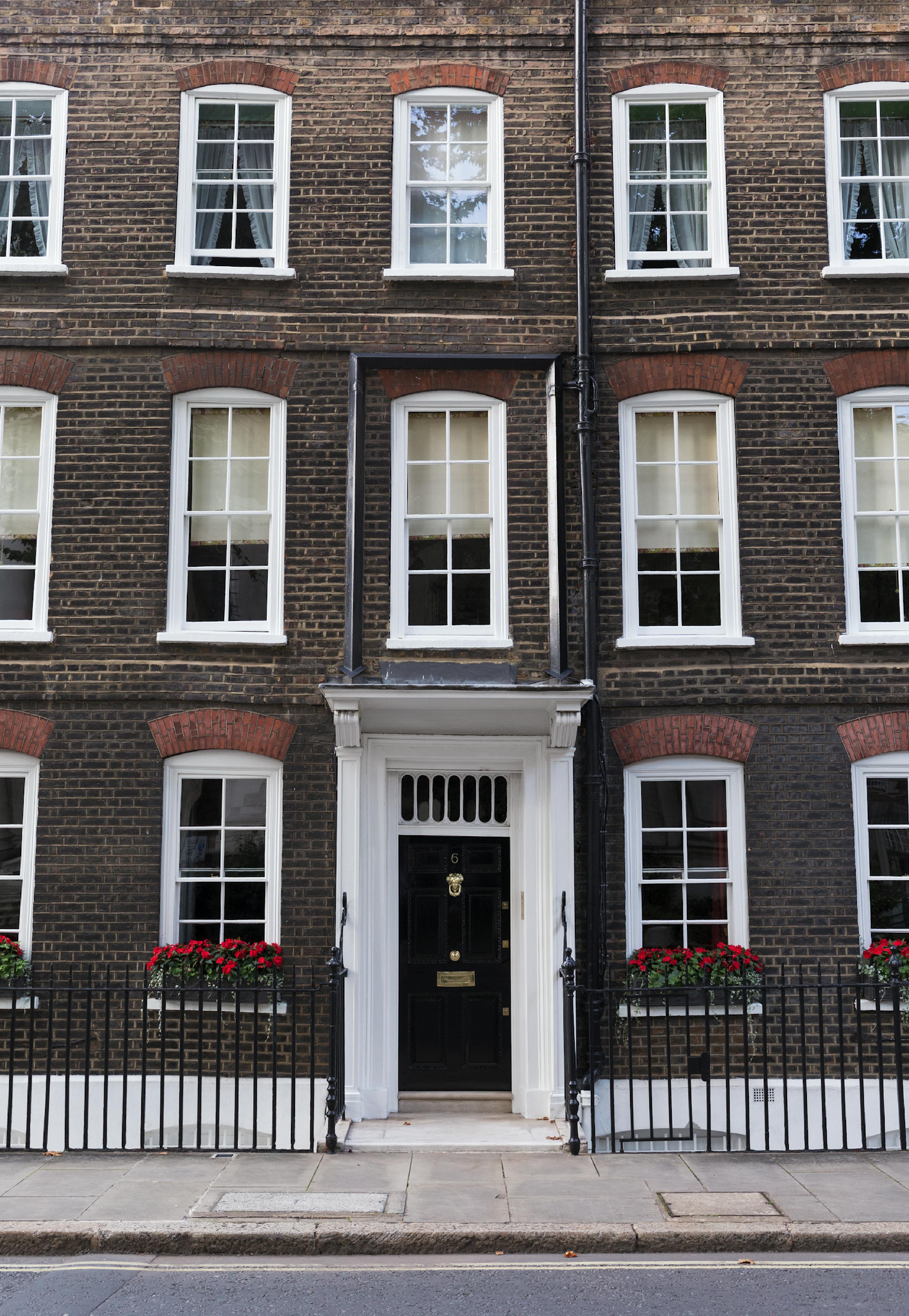 Elegant Georgian townhouse facade in London, showcasing traditional architecture.