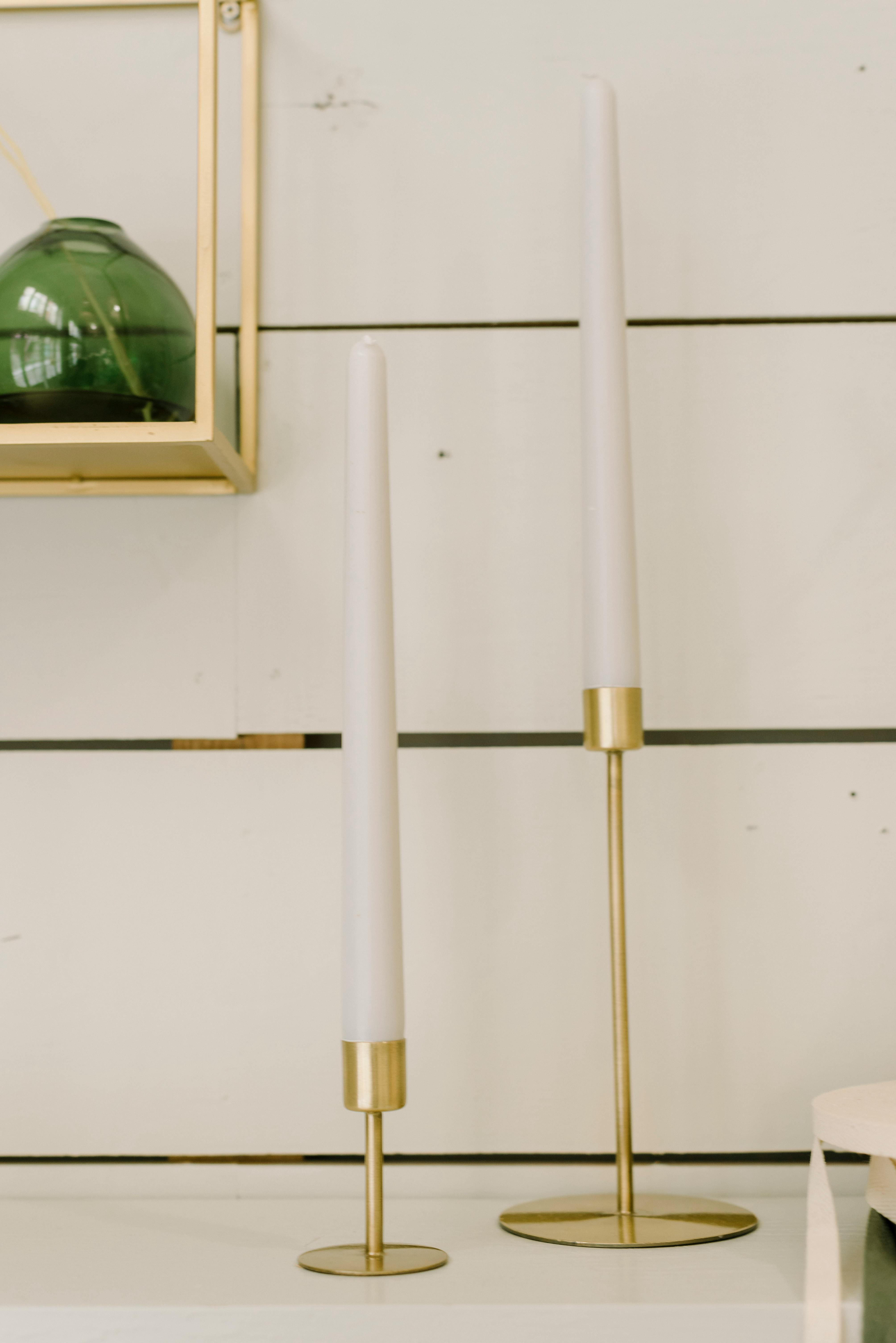 Vertical White Candles in Gold Holders · Free Stock Photo