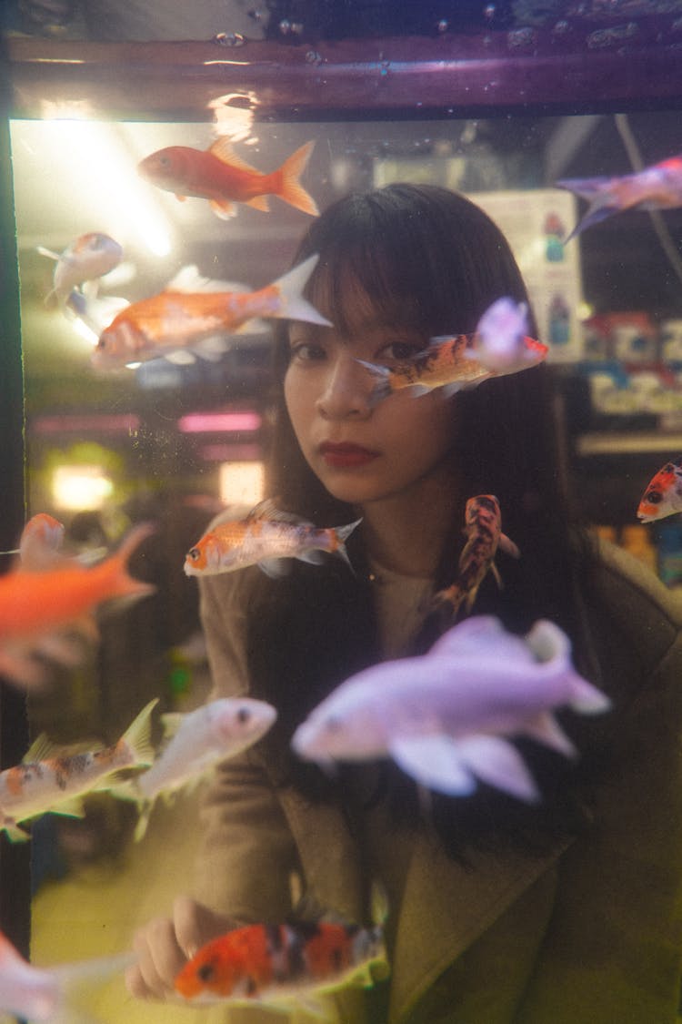 Woman Seen Through An Aquarium