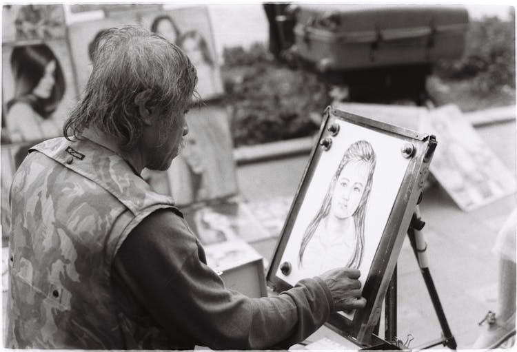 An Artist Drawing A Portrait 